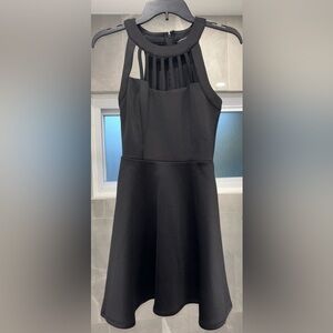 Black mini dress with high neck and slits from neck line